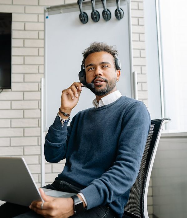 Focused man holding a kettlebell with a look of concentration.